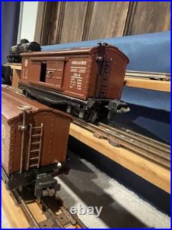 (2) Different Variations Prewar Lionel 3814 Operating Merchandise Boxcar