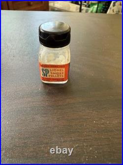 Lionel Vintage smoked pills pre-war bottle with someone in it? S